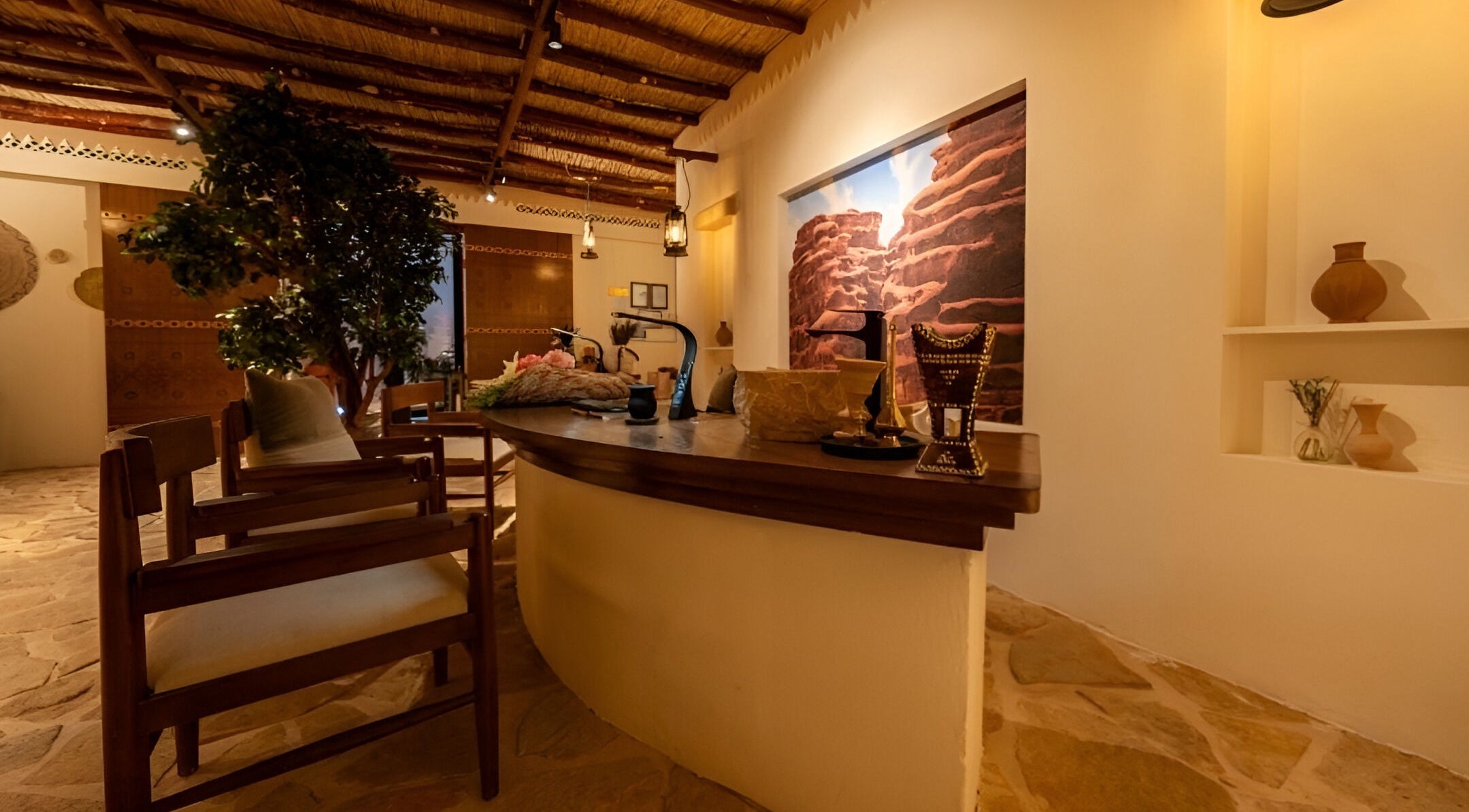 Cozy interior of Hisma Spa in Riyadh, featuring rustic wooden decor and warm lighting.