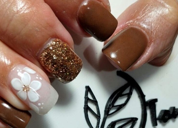 Elegant nail art at Classic Touch- Skincare & Nail Clinic, Rustenburg, North West, ZA with floral and glitter design.