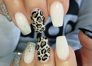 Leopard and glitter nail design at Classic Touch - Skincare & Nail Clinic in Rustenburg, North West, ZA.