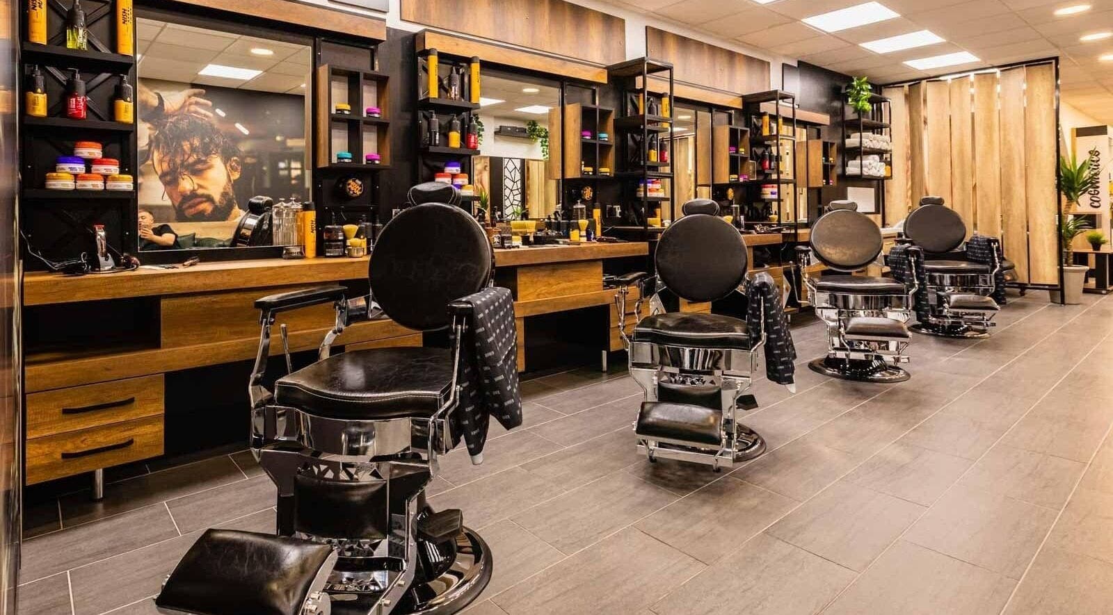 Modern barber chairs line The Look Barnsley in Barnsley, England, GB, showcasing a stylish interior.