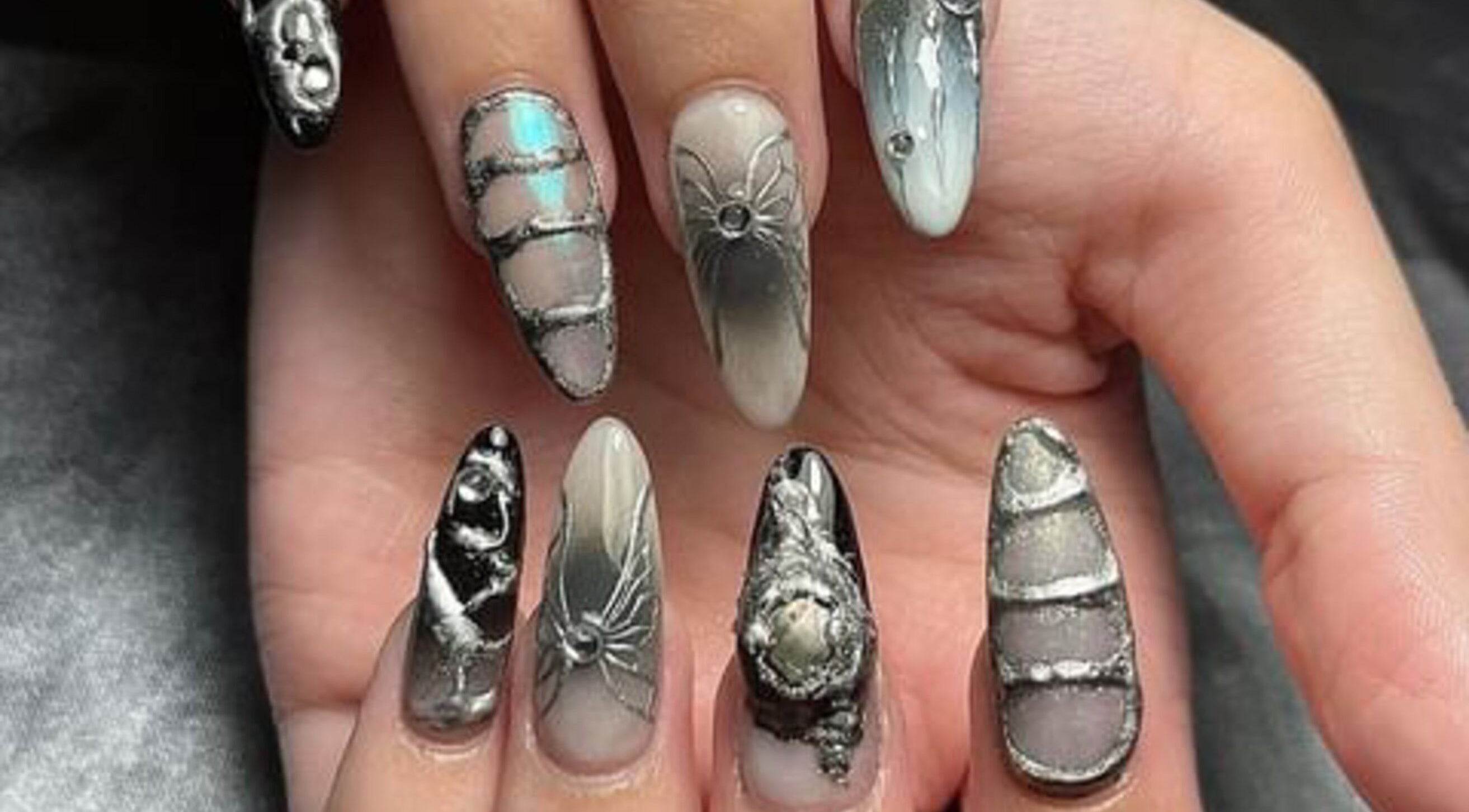 Intricate nail art with metallic designs at 22 Nail Bar, Richmond, British Columbia, CA.