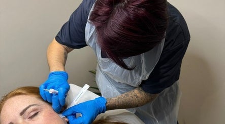 Aesthetician providing facial treatment at Aesthetics by Ria, Bournemouth, England, GB.