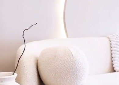 Elegant waiting area at Balance + Me, Denton, England, GB. Features plush white seating and decorative accents.