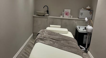 Relaxing therapy room at Balance + Me in Denton, England, GB with a massage bed and peaceful decor.