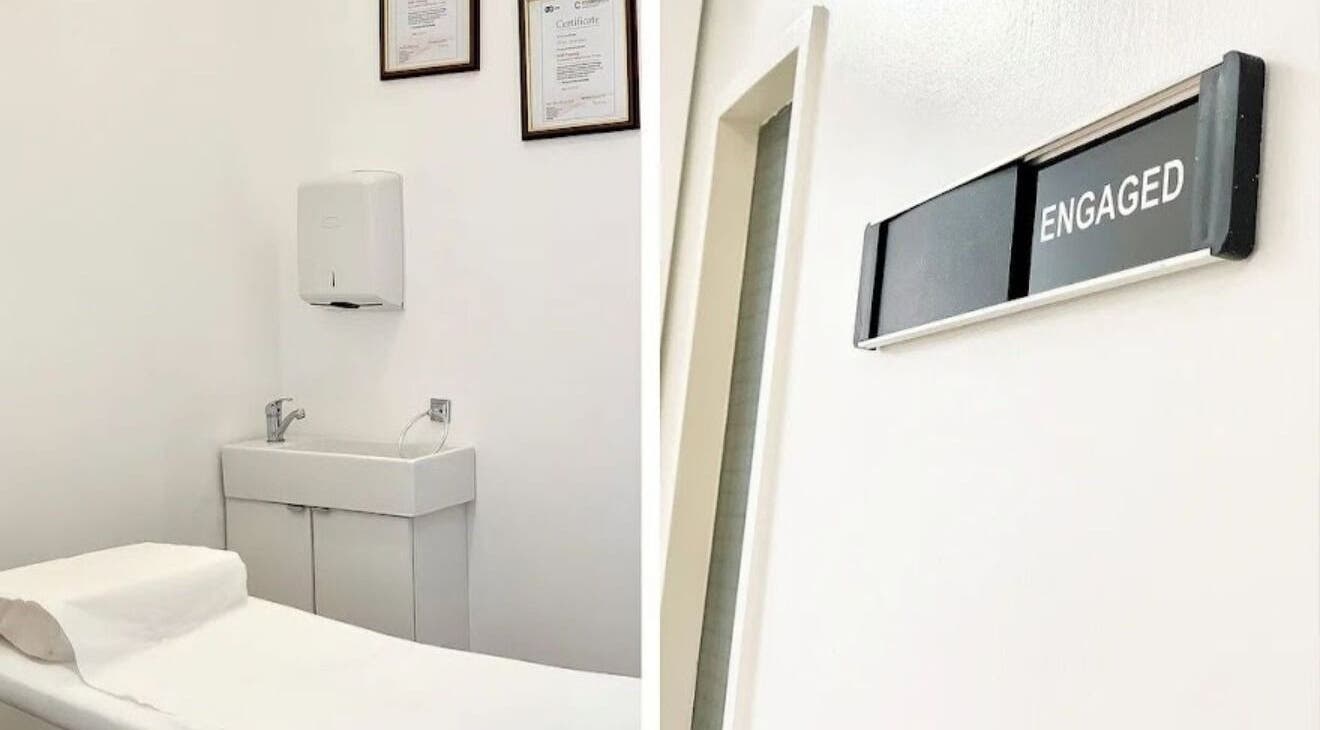 Treatment room at Essentials Aesthetic Clinic, London, England, GB, featuring clean decor and a massage table.