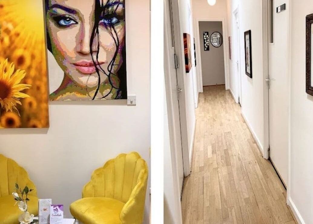 Welcoming interior at Essentials Aesthetic Clinic, London, England, GB with vibrant artwork and cozy seating.
