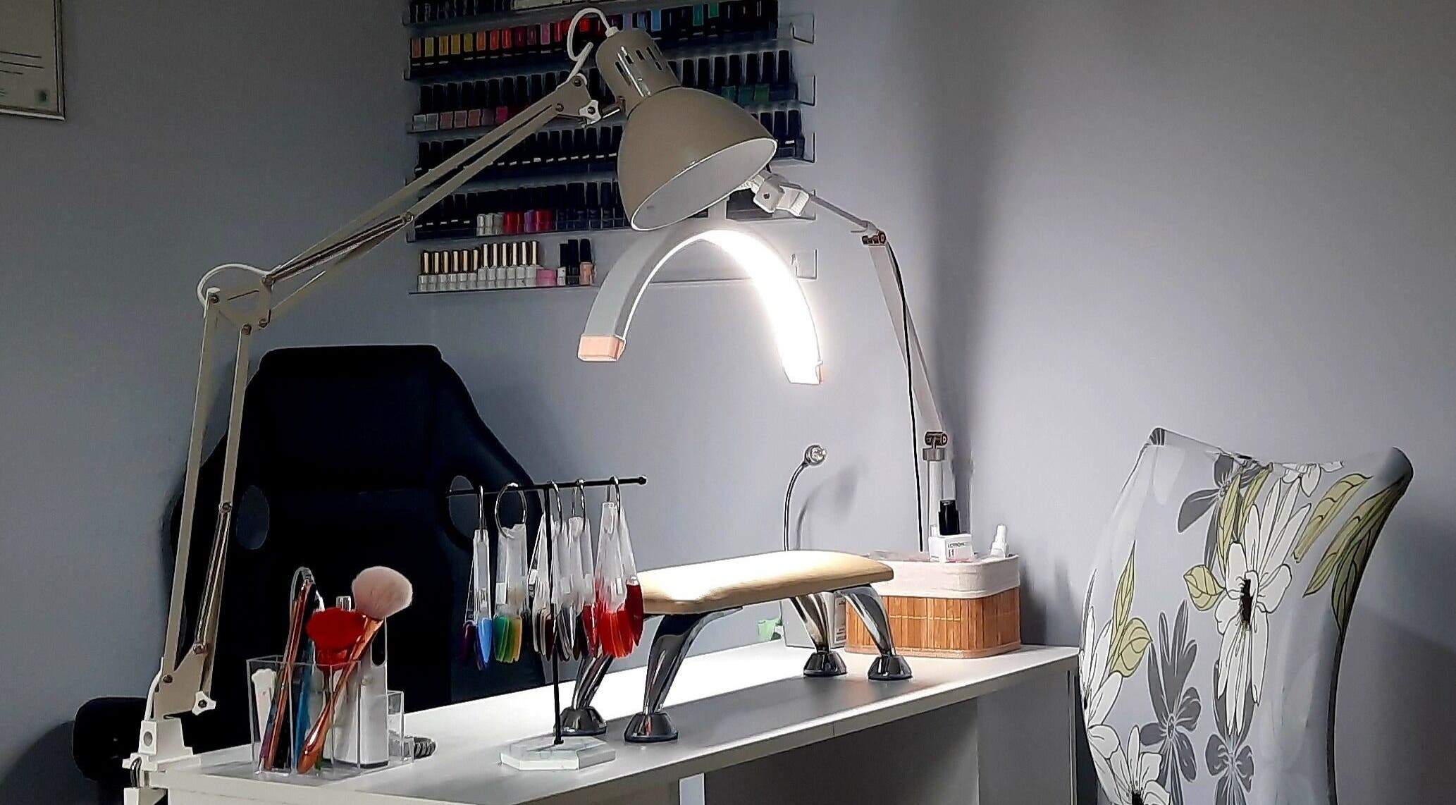 Cozy nail station at Twinkle nails by Tina, Watford, England, GB with tools and vibrant polish options.