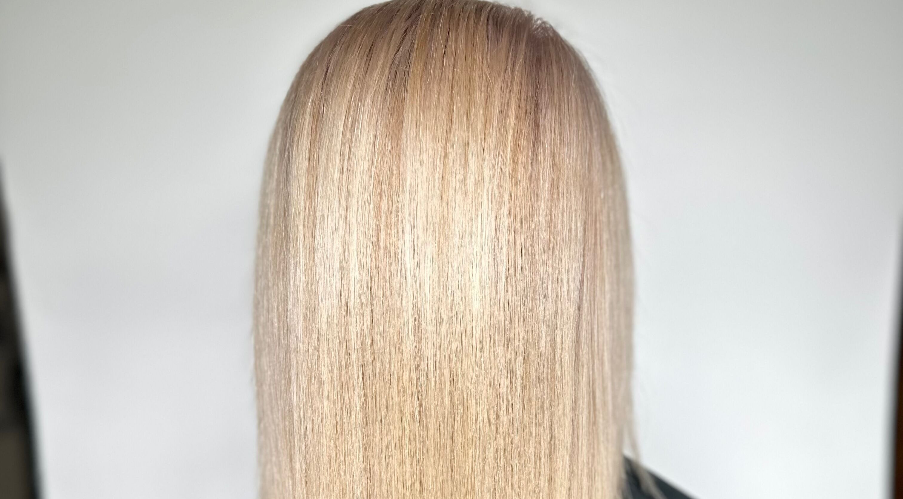 Sleek blonde hair styled at Deya Hairtylist in Dublin, Ireland. IE, showcasing expert hair treatment.