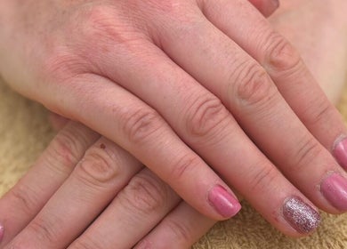 Elegant pink manicure with glitter detail at Holly Chantelle Beauty, Newton Abbot, England, GB.