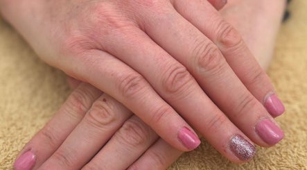 Elegant pink manicure with glitter detail at Holly Chantelle Beauty, Newton Abbot, England, GB.