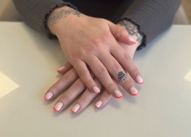 Elegant manicure with bright tips at Holly Chantelle Beauty, Newton Abbot, England, GB.