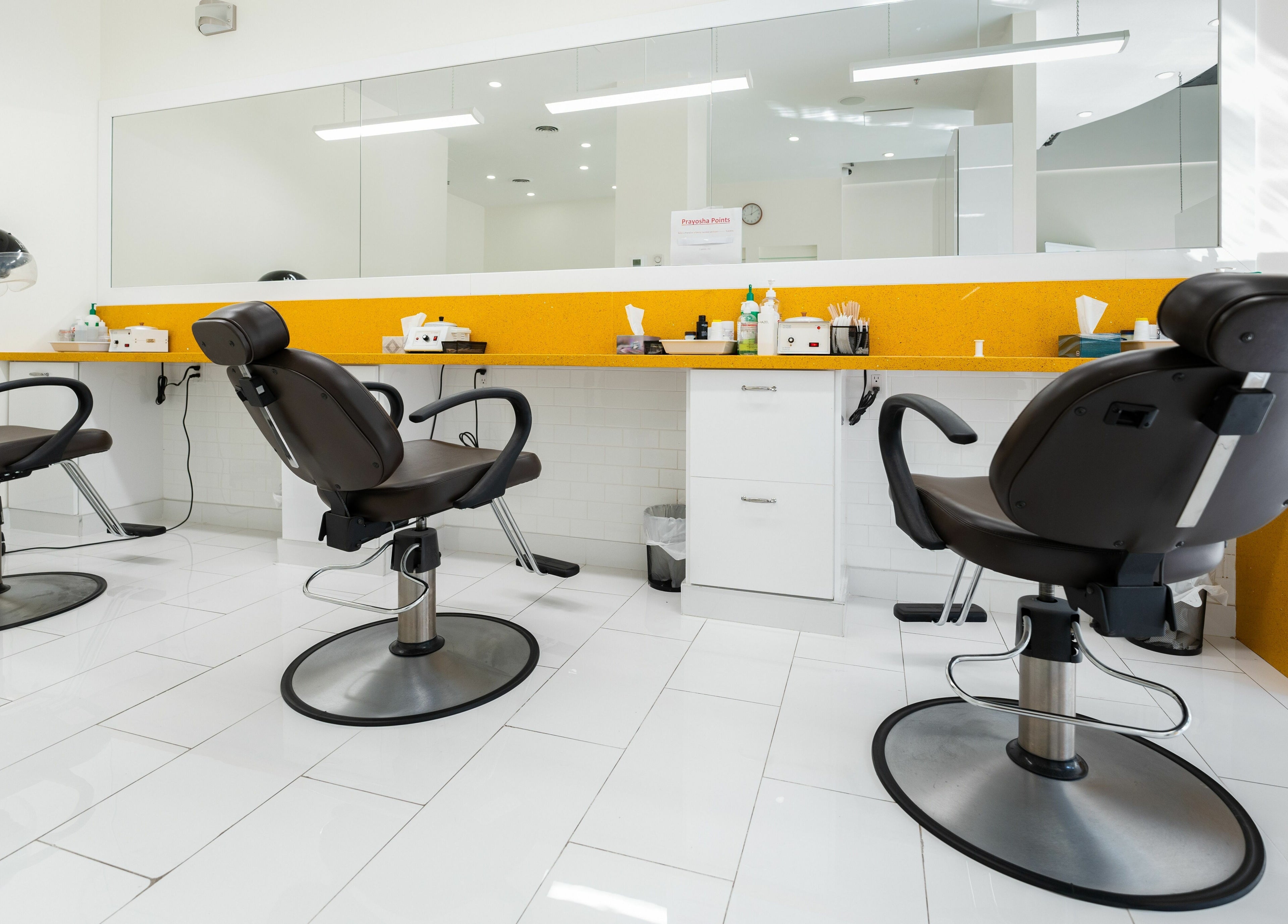 Modern salon chairs at Prayosha Threading & Wax Bar - Bathurst St., Toronto, Ontario, CA.