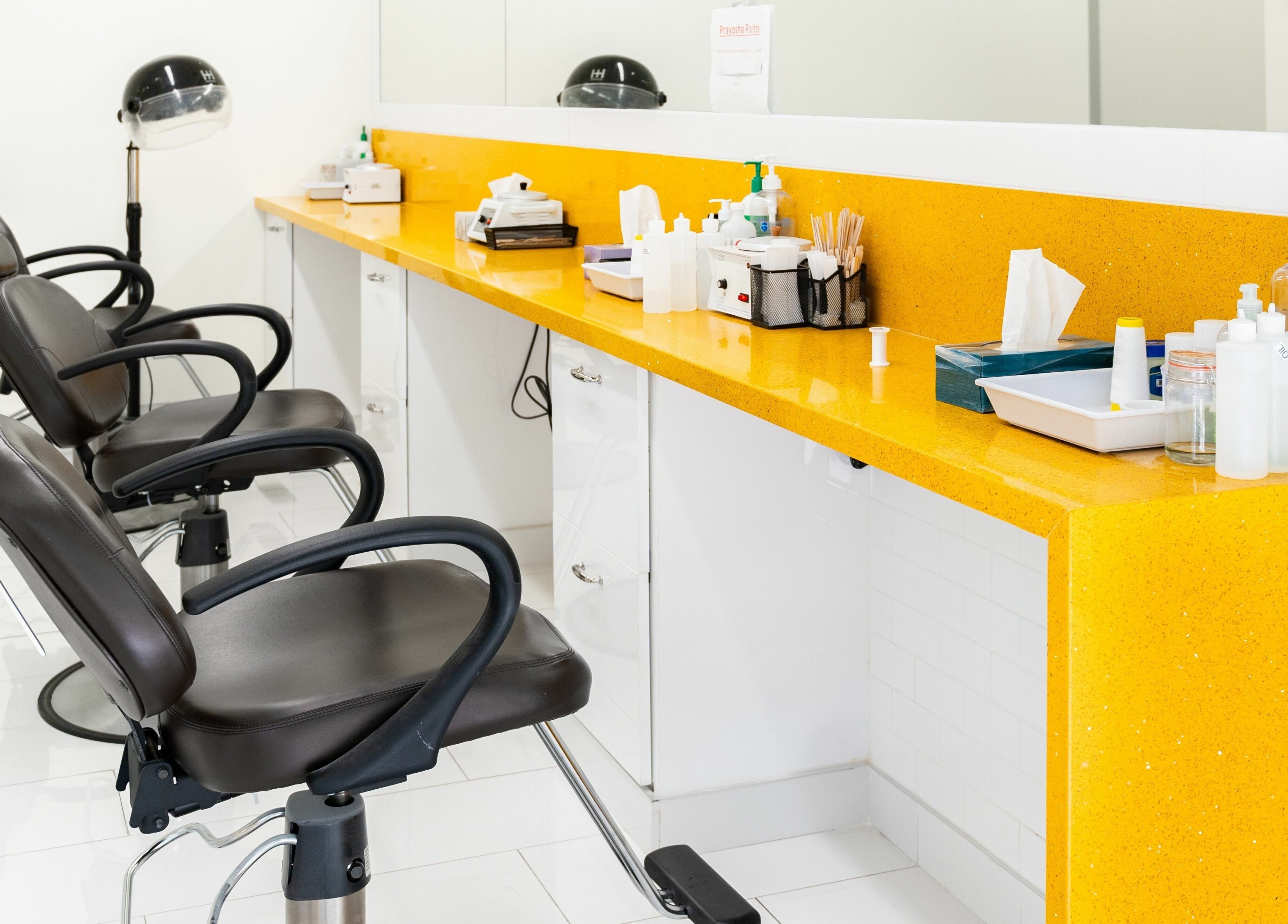 Stylish salon chairs and counter at Prayosha Threading & Wax Bar - Bathurst st., Toronto, Ontario, CA.