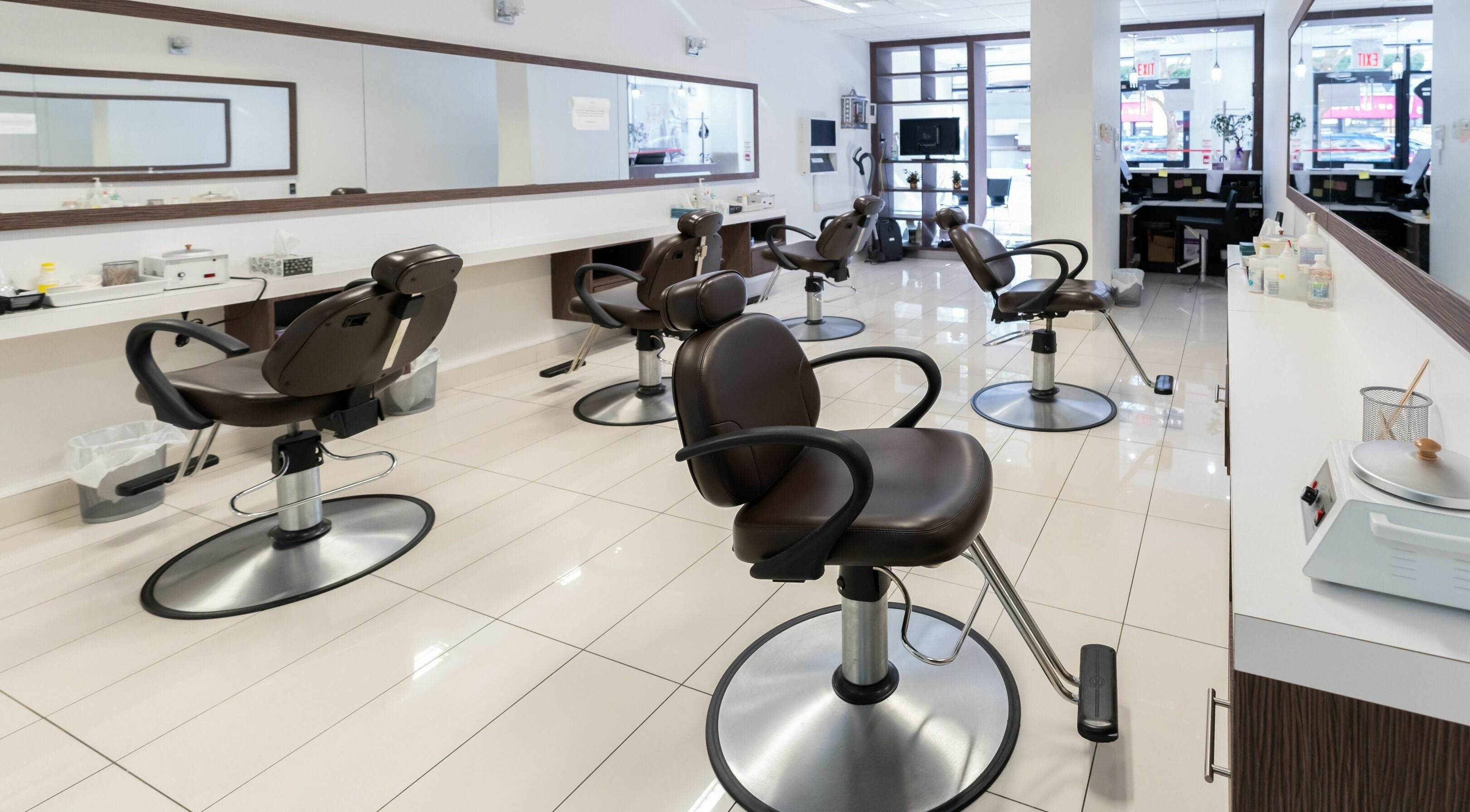 Modern salon interior with chairs at Prayosha Threading & Wax Bar - Younge Street, Toronto, Ontario, CA.