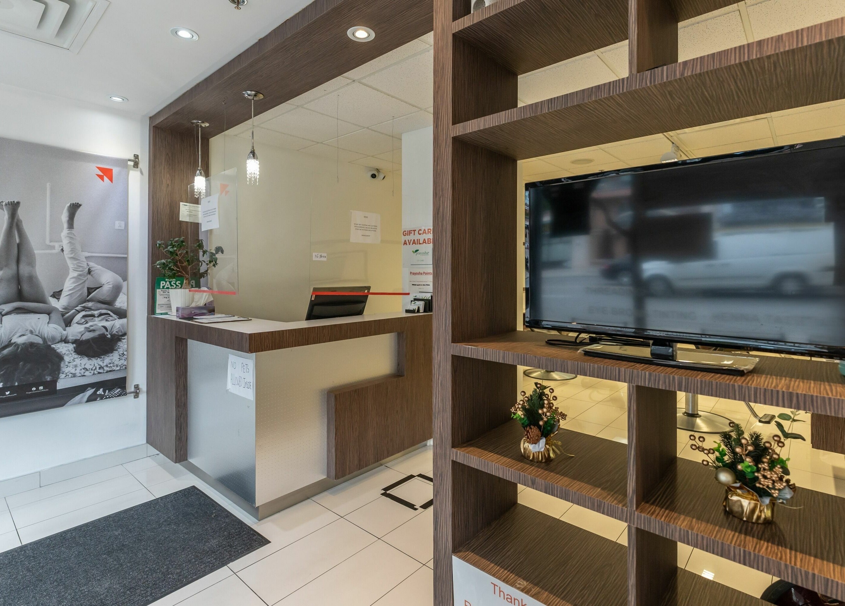 Reception area of Prayosha Threading & Wax Bar - Younge Street in Toronto, Ontario, CA showcasing modern design.
