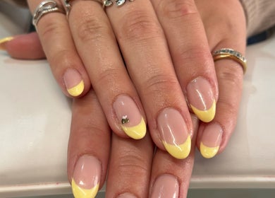 Yellow French manicure with bee accent by Nails by Emma in Swanage, England, GB.