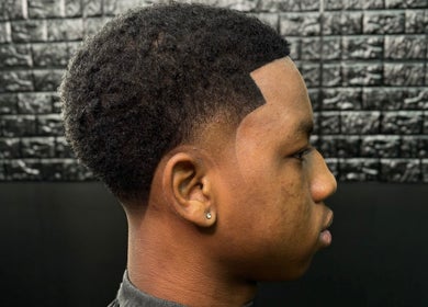 Side profile of a sharp fade haircut at JaviiClipper.Cutz, Nassau, New Providence, BS.