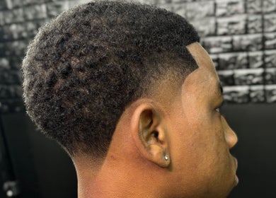 Close-up of a fresh haircut at JaviiClipper.Cutz, Nassau, New Providence, BS. Clean lines enhance sleek style.