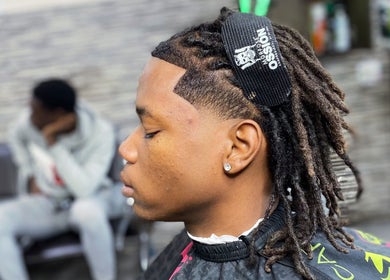Haircut showcasing styled locks at JaviiClipper.Cutz in Nassau, New Providence, BS.