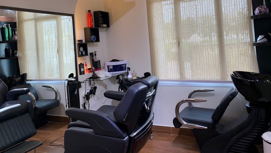 Modern salon interior at Mr Spa, Muscat, Muscat Governorate, OM with comfortable seating and professional equipment.