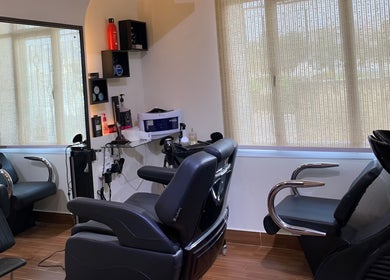 Modern salon interior at Mr Spa, Muscat, Muscat Governorate, OM with comfortable seating and professional equipment.