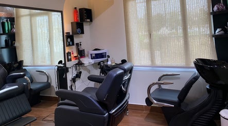 Modern salon interior at Mr Spa, Muscat, Muscat Governorate, OM with comfortable seating and professional equipment.
