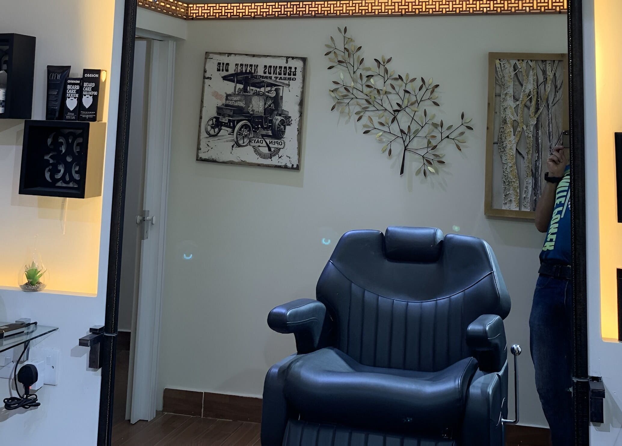 Modern barber chair at Mr Spa, Muscat Governorate, OM. Relaxing ambiance and stylish decor.