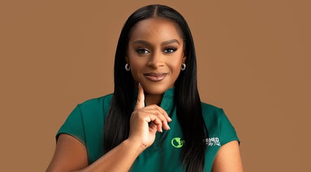 A professional wearing a green uniform represents Unblemished by Tish in South Hill, AI.