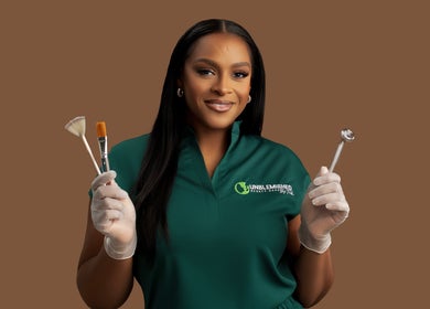 Beauty specialist at Unblemished by Tish (Anguilla), South Hill, holding skincare tools with precision.