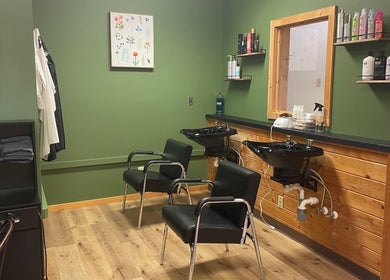 Interior of Signature Style Salon in Trego, Wisconsin, US, featuring modern wash stations and sleek chairs.