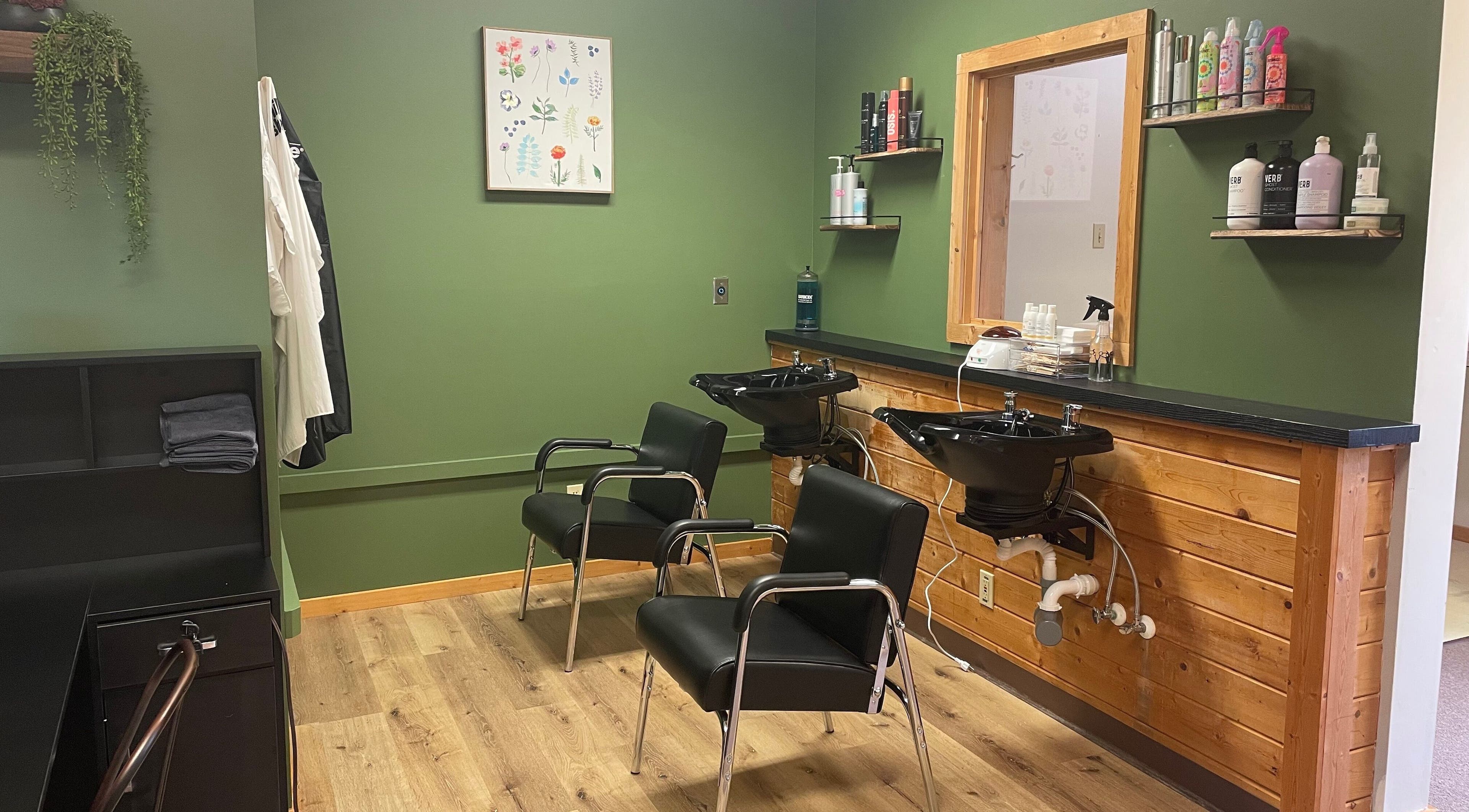 Interior of Signature Style Salon in Trego, Wisconsin, US, featuring modern wash stations and sleek chairs.
