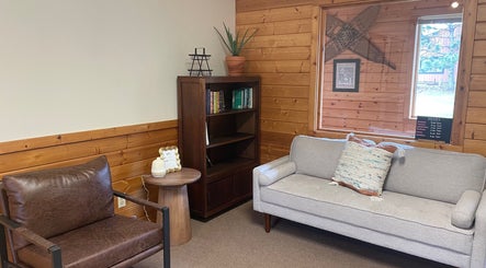 Inviting nook at Signature Style Salon in Trego, Wisconsin, US with comfortable seating and modern decor.