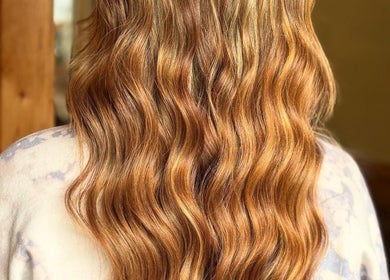Beautiful wavy hair styled at Signature Style Salon in Trego, Wisconsin, US.