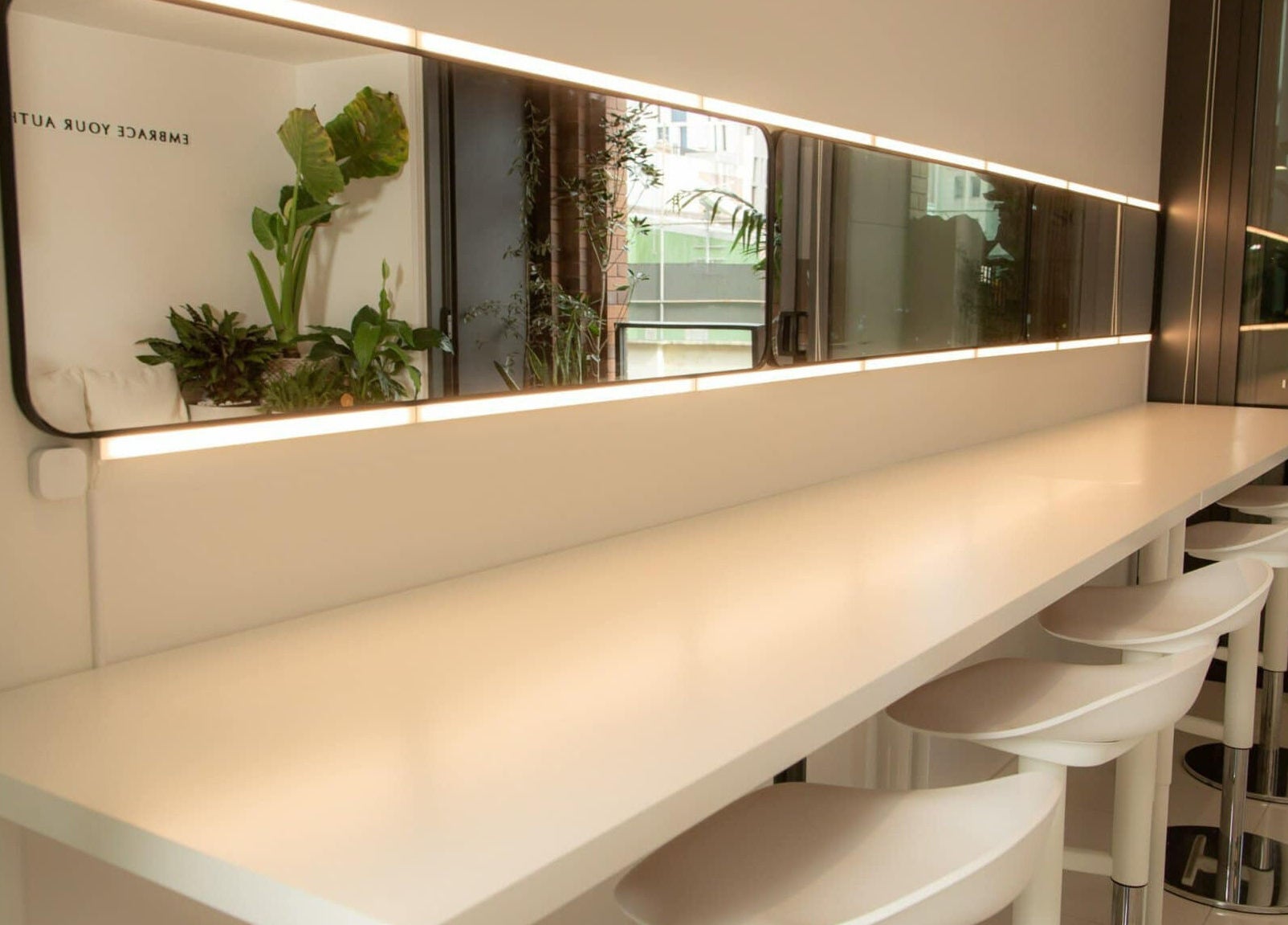 Modern beauty counter with sleek stools at Something Beauty House, Sydney, New South Wales, AU.