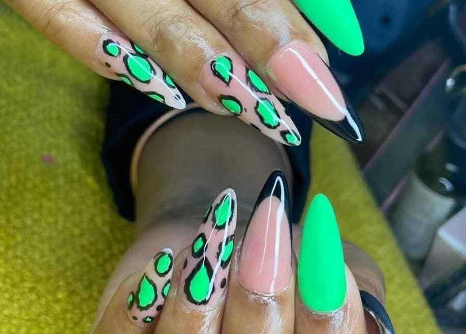Bold green and black nail design at Nenebeauty bar in Centurion, Gauteng, ZA showcasing intricate patterns.