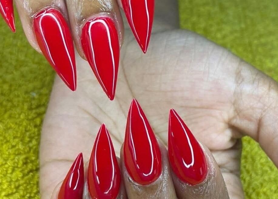 Stylish red stiletto nails at Nenebeauty bar, Centurion, Gauteng, ZA.