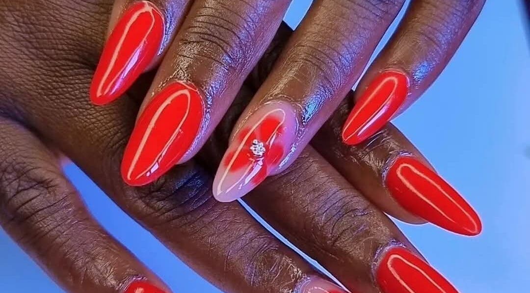 Elegant red manicured nails at Hair, Nails and Beauty Studio in Centurion, Gauteng, ZA.