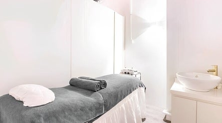 Elegant treatment room at The Spa Room, Singapore, Singapore, SG, featuring a plush massage table.