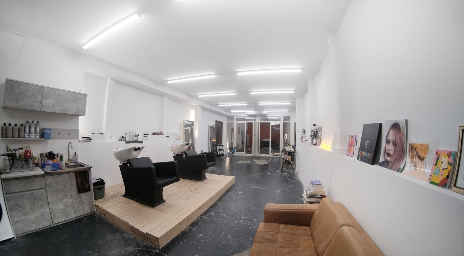 Modern salon interior at Fairfax Amsterdam, sleek design with styling chairs in Amsterdam, Noord-Holland, NL.