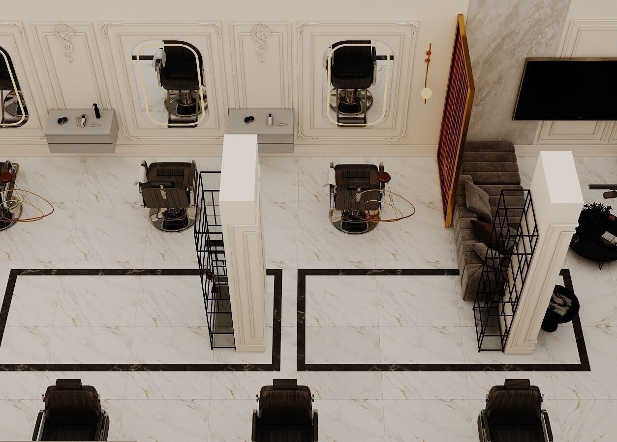 Luxurious salon interior at Grand Saloon in Amman, JO featuring stylish chairs and marble flooring.