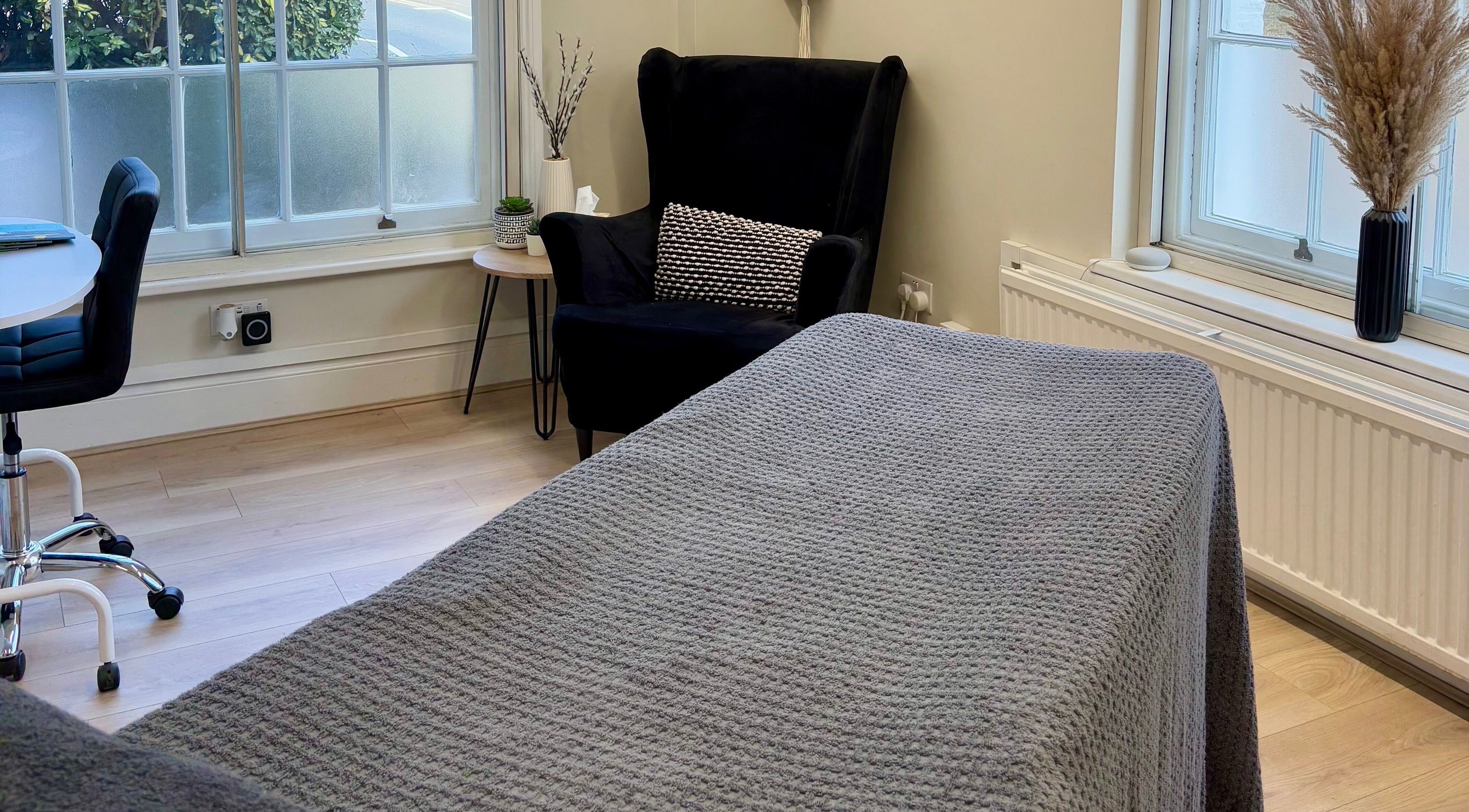 Inviting therapy room at L.A Beauty in Victoria Alice Brows Studio, Newbury, England, GB with cozy chair and table.
