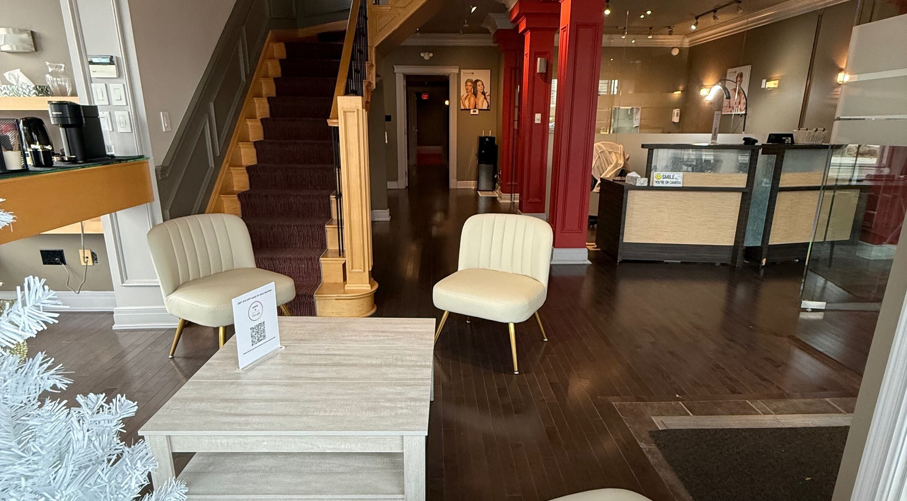 Inviting lobby at London, ON beauty spa features plush seating and upscale decor in London, Ontario, CA.