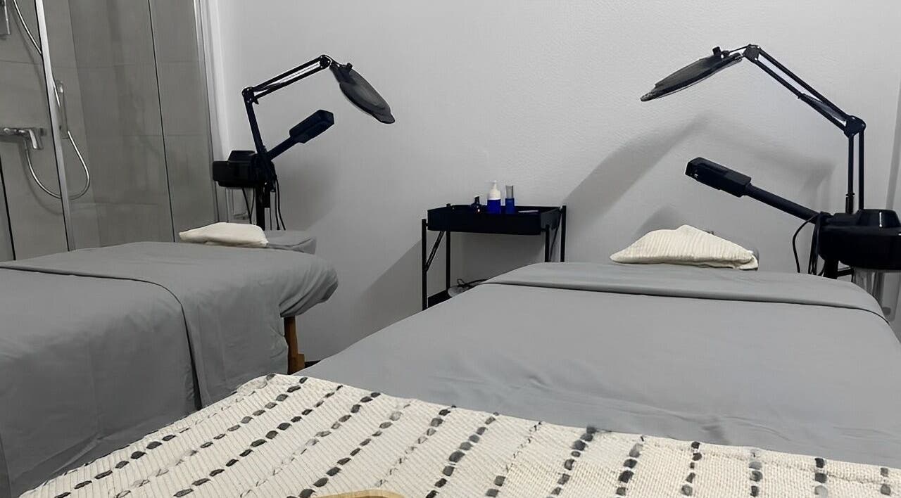 Treatment room at MP Spa and Aesthetics Clinic in Oistins, Christ Church, featuring two spa beds and equipment.