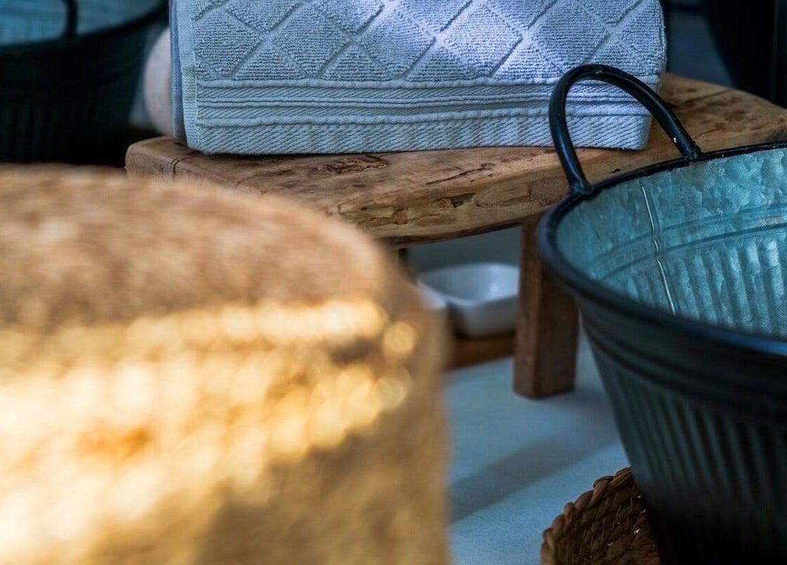 Relaxing decor at MP Spa and Aesthetics Clinic, Oistins, Christ Church, BB showcasing a rustic metal basin and towels.