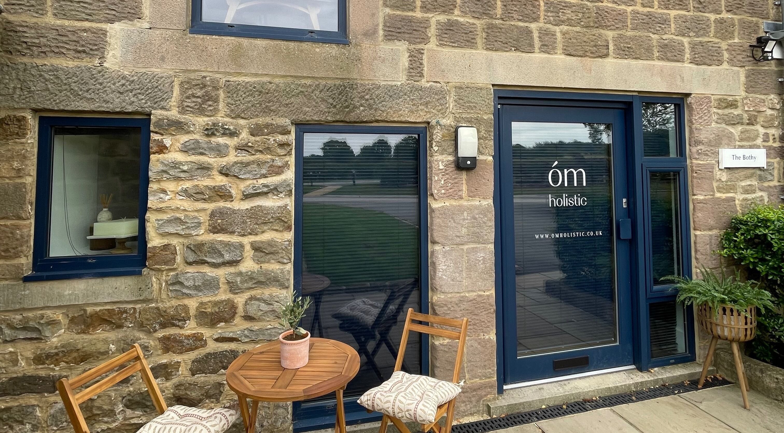 Front entrance of The Bothy – A Sanctuary By ōm Holistic in Harrogate, England, GB, showcasing rustic stone design.
