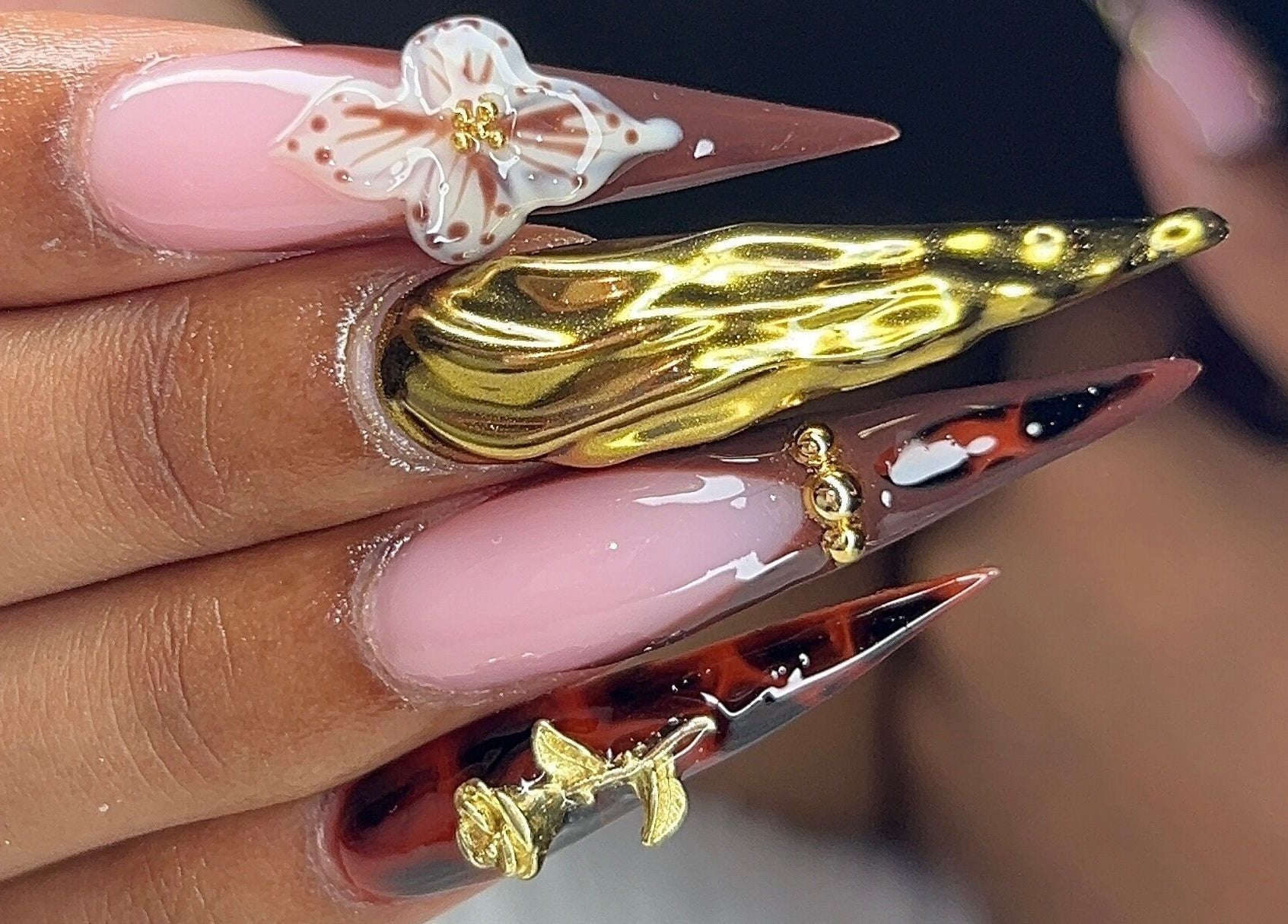Exquisite nail art with gold accents at Poly_ by_Blitz in Bridgetown, Saint Michael, BB.