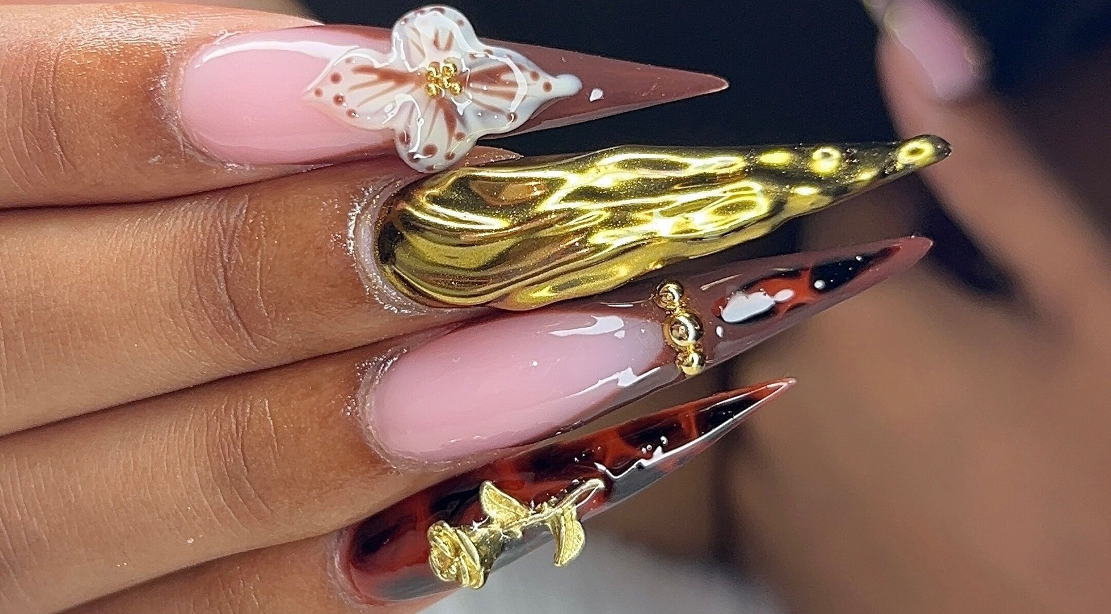 Exquisite nail art with gold accents at Poly_ by_Blitz in Bridgetown, Saint Michael, BB.