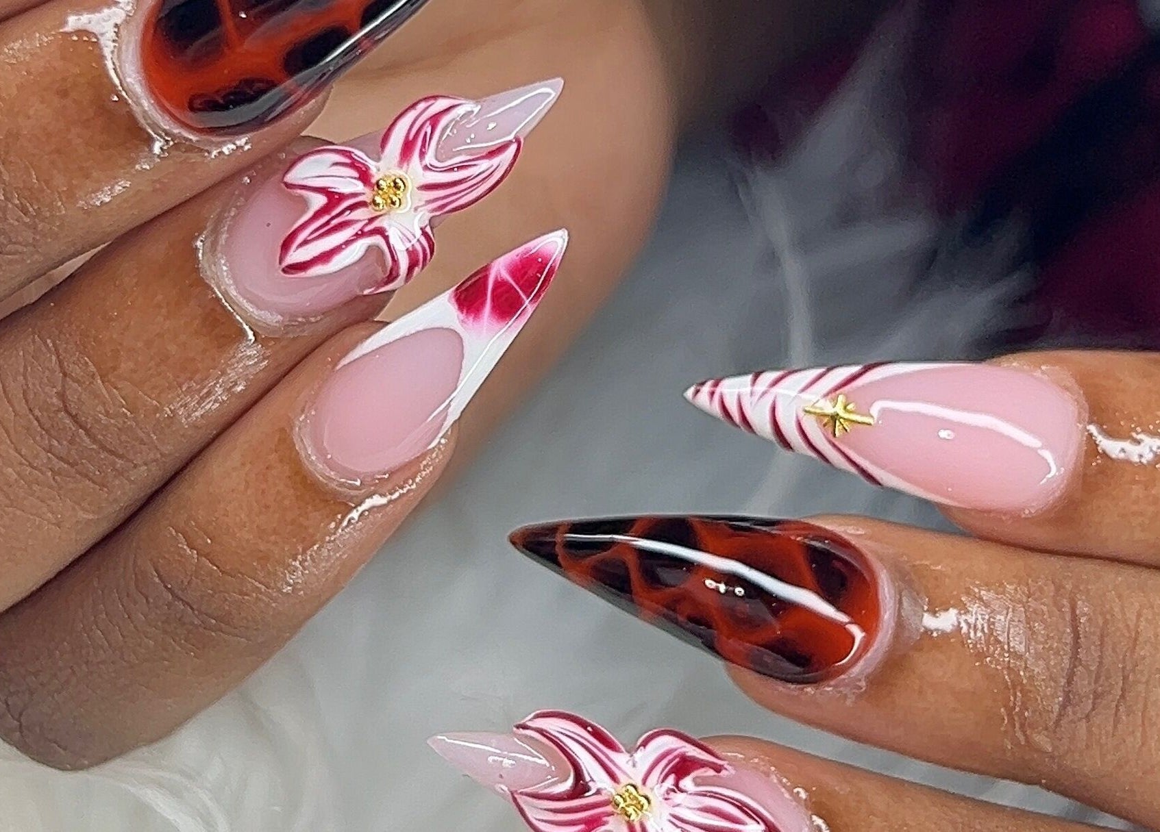 Intricate nail designs featuring floral and swirl patterns at Poly_ by_Blitz, Bridgetown, Saint Michael, BB.