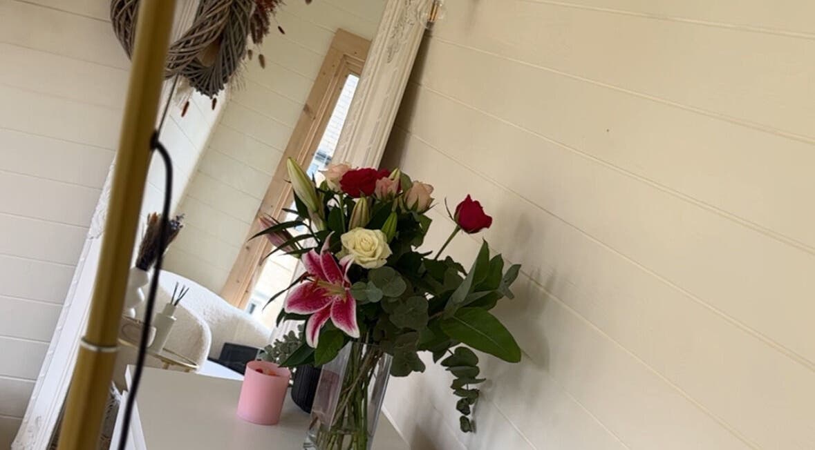 Elegant floral arrangement at Daisy Lee Lashes and Brows, Bingley, England, GB, enhancing serene interior decor.