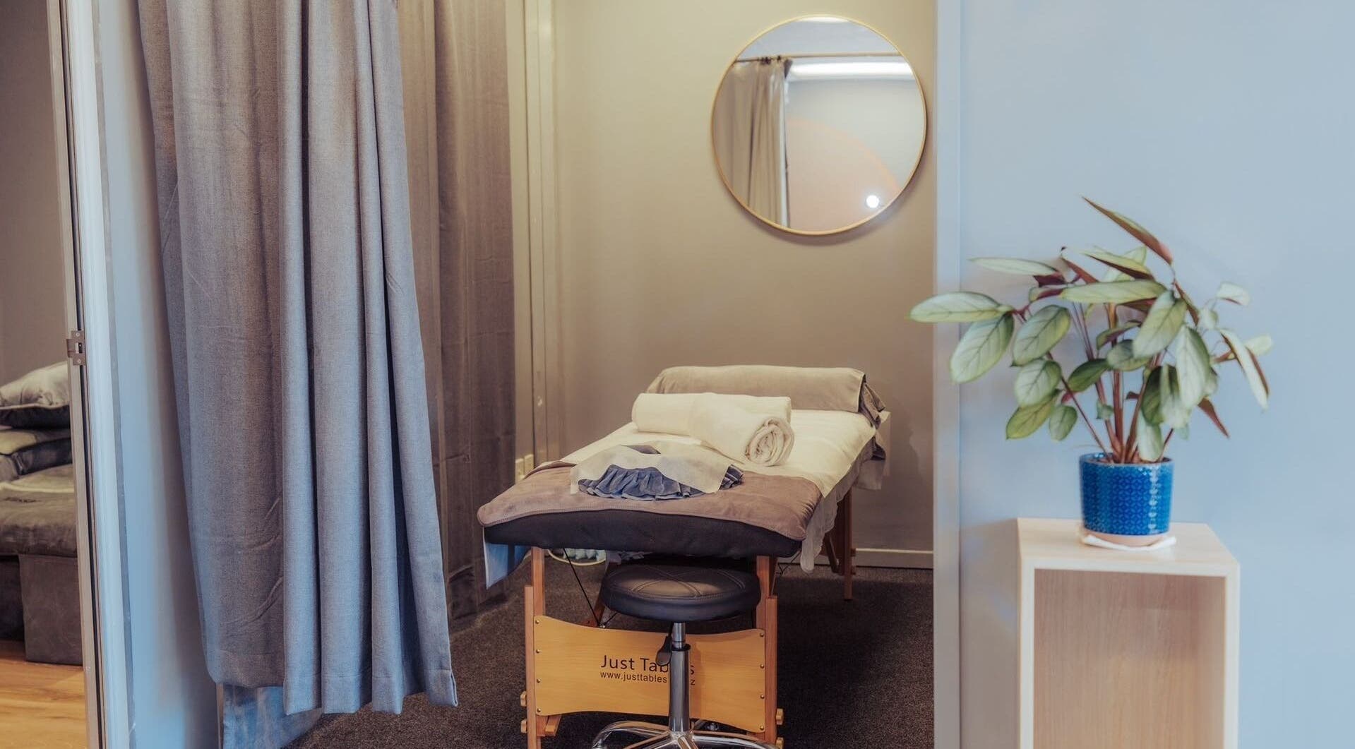 Relaxing massage room at JM's Massage in Auckland, Auckland, NZ with a comfortable table and calming decor.
